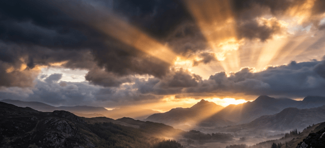 Sunset rays piercing dramatic clouds over a winding river and forested valley